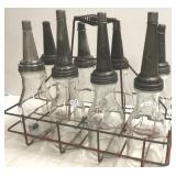 8 vintage oil bottles with carrier