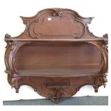 Carved walnut wall shelf