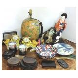 Group of oriental items, foo dogs, oriental stands