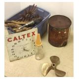 Group including advertising can, prop, clock,