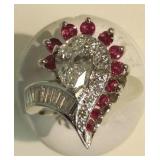 14k ring set with .77 ct pear diamond, baguette