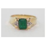 14k yellow gold ring set with an emerald &