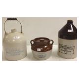2 advertising stoneware jugs (tiny chip on one) &