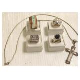 4 sterling rings & a sterling cross on chain