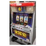 Token slot machine with key