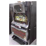 Pegasus token slot machine with key