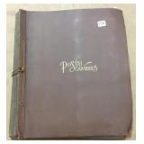 Large album of postcards including real photo