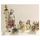 Group of Staffordshire figures including spill