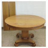 45" round oak pedestal table with 2 leaves