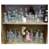 Large group of milk bottles, some advertising, etc