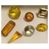 7 large faceted gemstones- topaz, citrine, etc