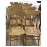 6 matching oak press back chairs