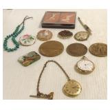 Group including pocket watches, bronze medallions,