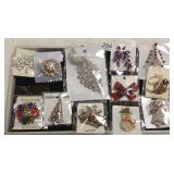 12 costume brooches