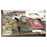 Group including dog figures, photos, books,