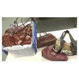 Large group of purses including leather, etc.