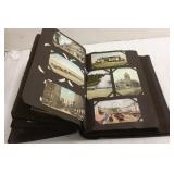 Antique postcard album with postcards including