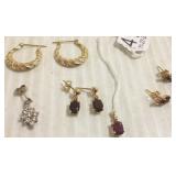 Group of assorted gold earrings some with stones