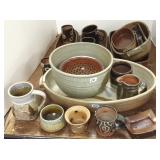 Group of assorted studio pottery including handled