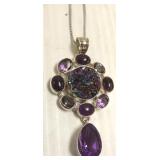 Sterling pendant on chain set with amethysts, etc
