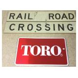 Metal railroad crossing sign & a metal Toro