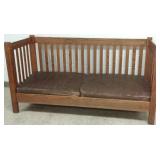 Oak arts & crafts settle with worn leather