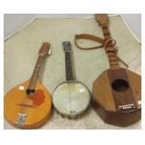 3 stringed instruments including a small banjo