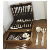 Set of ornate silverplate flatware in chest