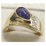 14K gold ring set with star sapphire & side