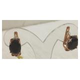 Pair of 14K gold earrings set with black spinels
