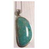 Large sterling pendant on chain set with turquoise