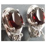 Pair of 14K white gold earrings set with garnets
