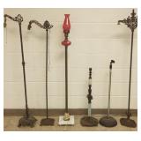 Group of floor lamps, microphone stand, etc