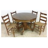 Round table with claw feet & 4 chairs