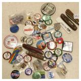 Group of pinback buttons, pocket knives, etc.