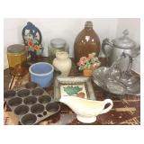 Group including 2 iron doorstops, kitchen jars,