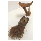 Antique carved wood head rest & an African mask
