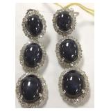 Pair of 14K white gold dangle earrings set with