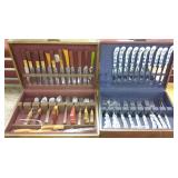 2 sets of flatware in case- blue & white etc.