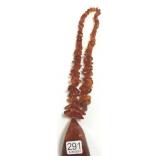 24" strand of amber beads with pendant 4 troy oz.