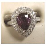 Platinum ladies ring set with pear shaped purple/