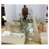 Group of laboratory glass beakers, etc