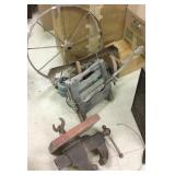 Group including a vise, iron wheel, grinder,