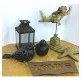 Group garden decor including cast iron birds,
