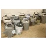 Large group of galvanized water cans