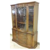 Mahogany breakfront with curved glass