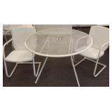 2 vintage metal spring chairs & a table