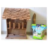Wooden rabbit feeder with feed