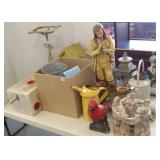 Group of assorted garden decor, including sprinkle