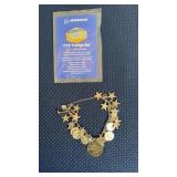 CHARM BRACELET W/ (7) STERLING SILVER CHARMS
